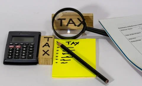 The image shows a set of objects related to tax calculation and financial a.. 스톡 사진