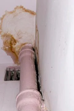 The image shows a significant problem with plumbing resulting in staining Stock Photos