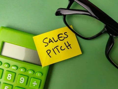 The image shows a sticky note with the words SALES PITCH on a green backgroun Stock Photos
