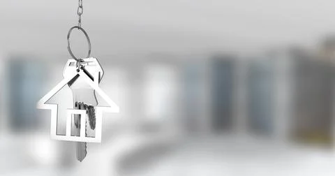 Image of silver house keys hanging against blurred background with copy space Illustrazione stock