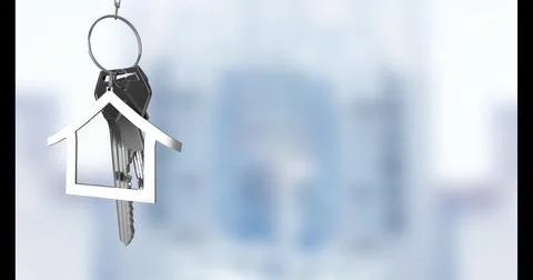 Image of silver house keys hanging against blurred background with copy space Illustrazione stock