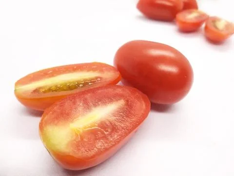 Image of small red tomatoes on a white background isolate Stock Photos