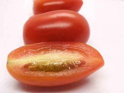 Image of small red tomatoes on a white background isolate Stock Photos
