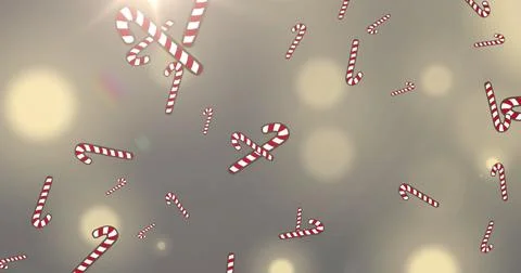 Image of snow and christmas candy canes falling over spot lights in background Ilustração Stock