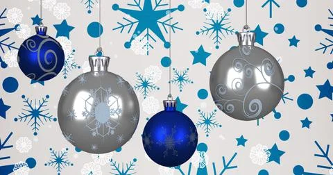 Image of snow falling over christmas baubles and stars on white background Ilustração Stock