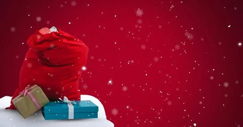 Image of snow falling over christmas presents with copy space on red backgrou Stock Illustration