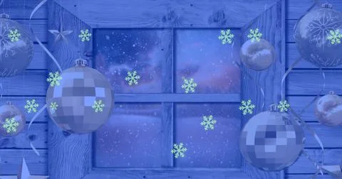 Image of snow falling over christmas baubles decoration and winter scenery Ilustração Stock