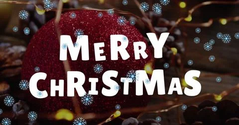 Image of snowflakes falling over merry christmas text against close up of Stock Photos