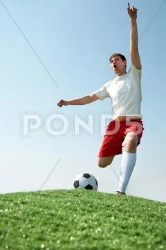Image of soccer player shouting during game Stock Photos