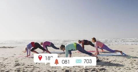 Image of social media data processing over diverse women exercising on beach Stockfoto's