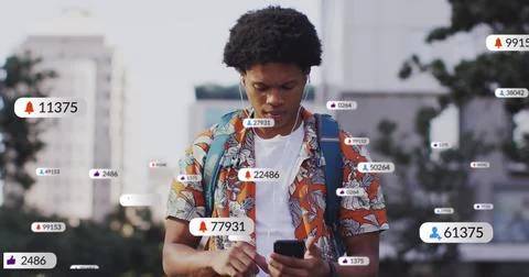 Image of social media data processing over african american man using smartphone Foto stock