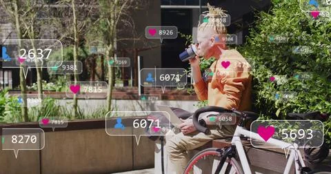 Image of social media data processing over albino man drinking coffee in city 库存照片