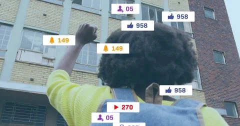 Image of social media data processing over african american man with fist in the Stock Photos