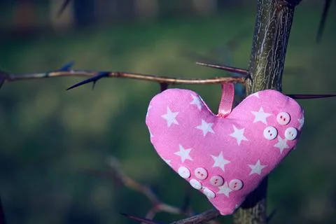 An image of a soft toy in the shape of a heart. Handicraft work. Stock Photos