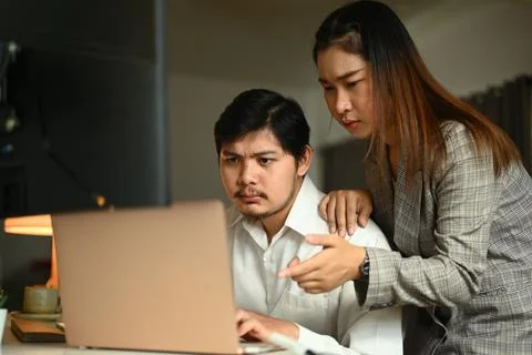 Image of software developers team brainstorming and programming on desktop Stockfoto's