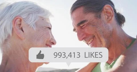 Image of speech bubble with thumbs up icon and numbers over happy senior couple Ilustração Stock