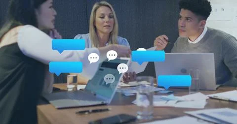 Image of speech bubbles icons over diverse business people Stock Photos