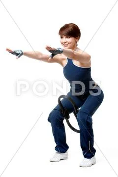 Image of sporty girl standing on the floor and doing physical exercise Stock Photos