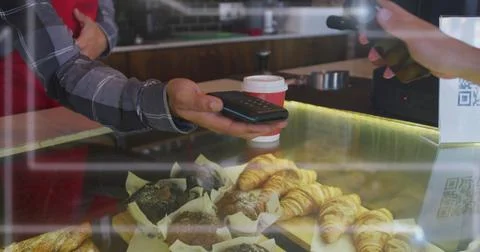 Image of spots of light over man serving coffee working in cafe Stock Photos