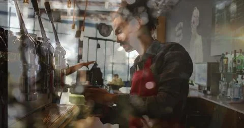 Image of spots of light over man making coffee working in cafe Foto stock