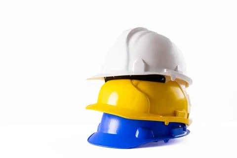 Image of stack of helmets lying on white surface 스톡 사진