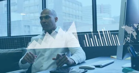 Image of statistical data processing against thoughtful biracial man at office Foto stock