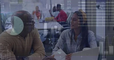 Image of statistical data processing against diverse man and woman discussing at Stock Photos