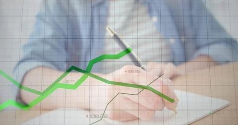 Image of statistical data processing against mid section of a man taking notes 库存照片