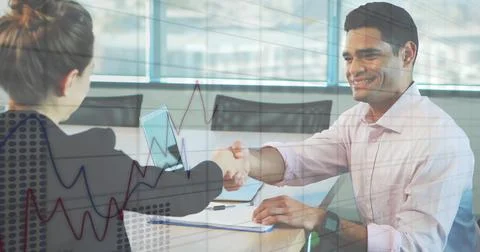 Image of statistical data processing against diverse man and woman discussing at Foto stock