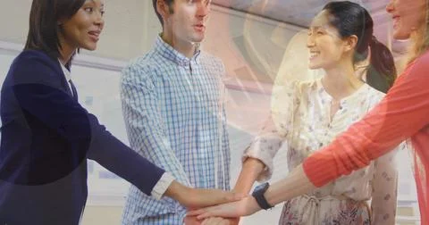 Image of statistical data processing over diverse colleagues stacking hands.. 库存照片