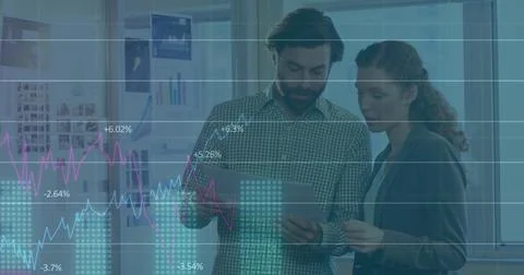 Image of statistical data processing over caucasian man and woman discussing 库存照片