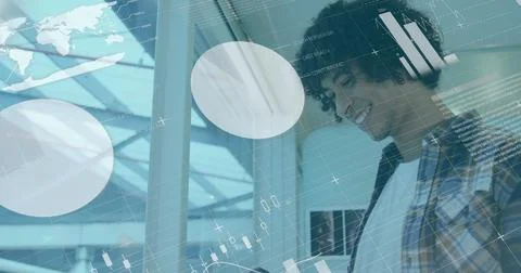 Image of statistical data processing over biracial man smiling while using .. Stock Photos