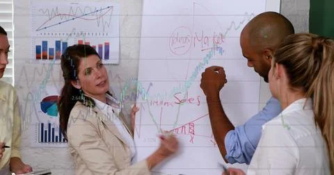 Image of statistical data processing over diverse businesspeople discussing over Stock Photos