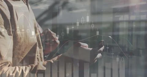Image of statistical data processing over mid section of a man using smartphone 스톡 사진