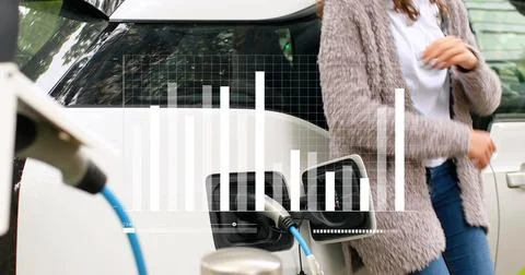 Image of statistical data processing over mid section of woman waiting while her Stock Photos