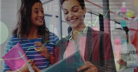 Image of statistical data processing over two diverse women discussing over 스톡 사진