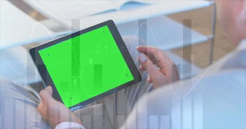 Image of statistical data processing over caucasian man using digital tablet Stock Photos
