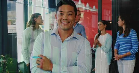 Image of statistical data processing over portrait of asian man smiling at Stock Photos