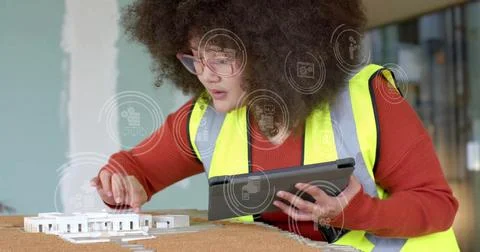 Image of statistics and data processing over biracial female architect in office Stock Illustration