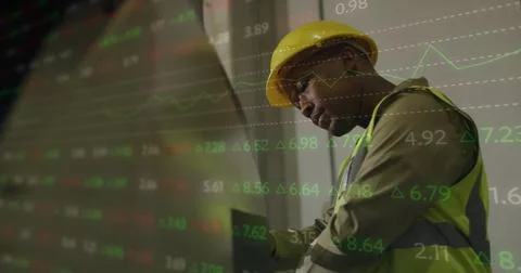 Image of statistics and data processing over african american man working in Stock Photos