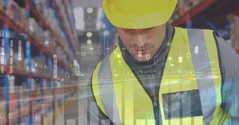 Image of statistics and data processing over caucasian man working in warehou Foto stock