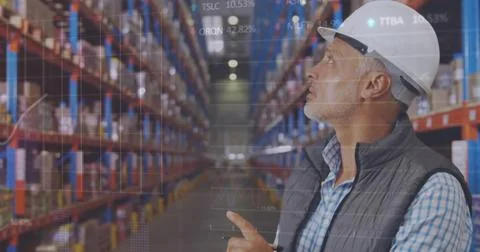 Image of statistics and data processing over caucasian man working in warehou Stock Photos