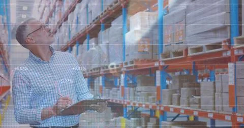 Image of statistics and data processing over caucasian man working in warehou Stock Photos