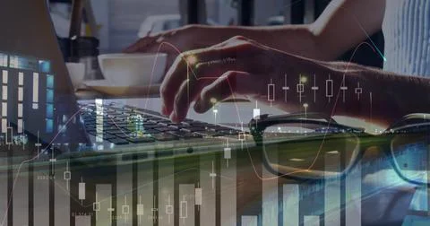 Image of statistics and data processing over woman using laptop Stockfoto's