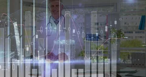 Image of statistics and data processing over male doctor 写真素材