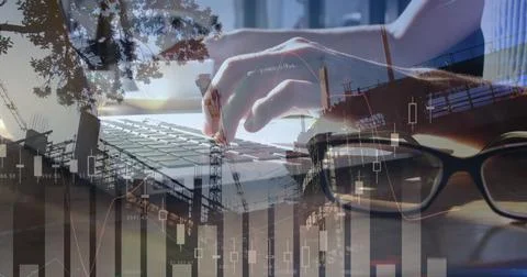 Image of statistics and data processing over man using laptop Foto stock