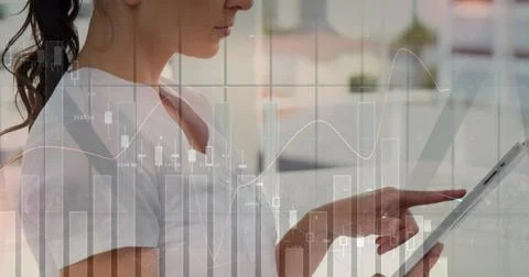 Image of statistics and data processing over woman using computer 写真素材