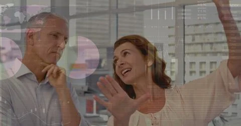 Image of statistics and data processing over business people at meeting Stock Photos