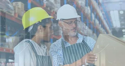 Image of statistics and financial data processing over man and woman working in Stock Photos