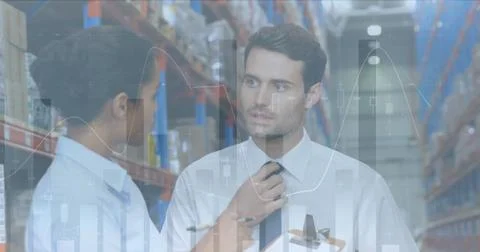 Image of statistics and financial data processing over man and woman working in Foto stock